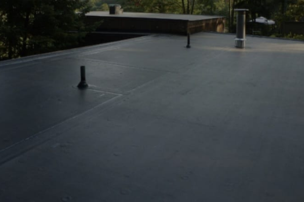 a commercial epdm roof with round ventilation units, possibly used for exhaust or intake